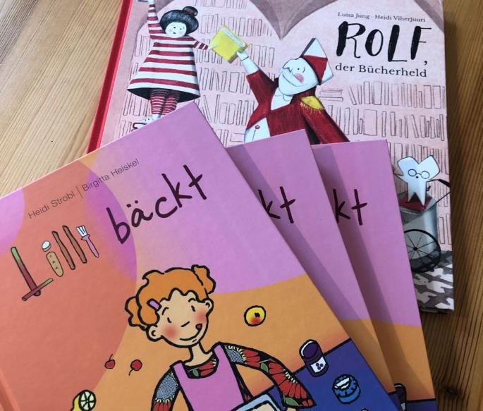 Foto der Kinderbücher "Lilli bäckt" und "Rolf der Bücherheld"